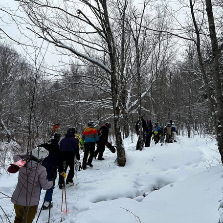 A photo provided by the Killington Police Department shows skiers and snowboarders heading to safety after they were rescued from the Vermont backcountry on Saturday, Jan. 20, 2024. A total of 23 people, including at least six juveniles, were rescued by first responders amid a blast of arctic air that plunged temperatures well below freezing.
