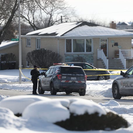 Police work at the scene of a shooting in Tinley Park on Sunday, Jan. 21, 2024. Authorities have identified a woman and her three adult daughters who were found slain inside their suburban Chicago home in what police are calling a domestic-related shooting.