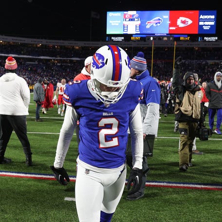Buffalo Bills place kicker Tyler Bass (2) walks off the field after missing what would have been a game tying field goal in a 27-24 loss to the Chiefs in the divisional round.