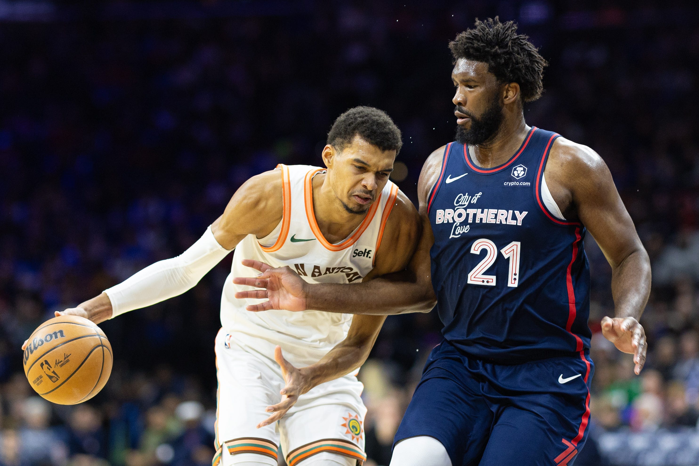 Victor Wembanyama dribbles against Joel Embiid during the third quarter at Wells Fargo Center on Jan. 22.