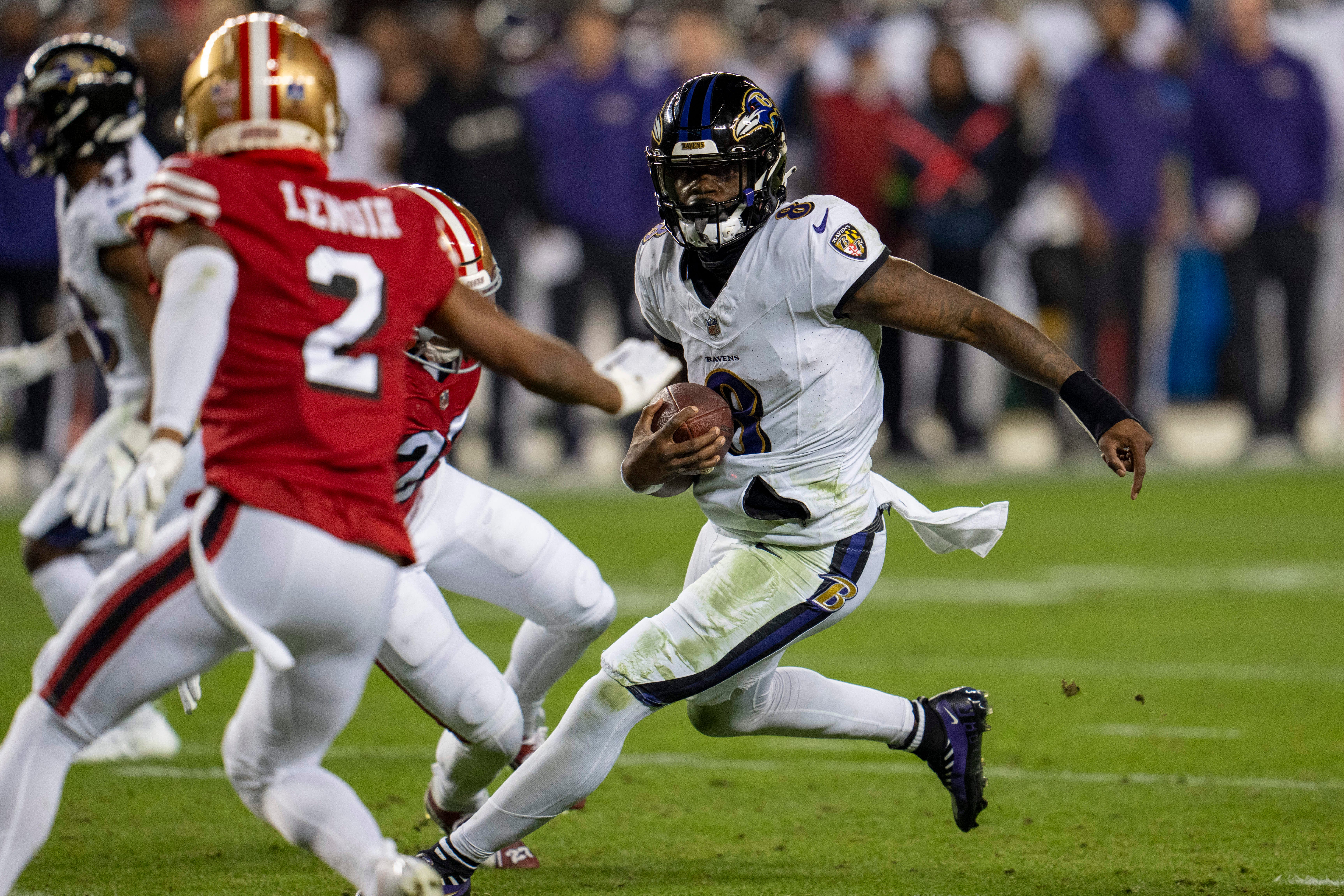 Dec 25, 2023; Santa Clara, California, USA; Baltimore Ravens quarterback Lamar Jackson (8) scrambles with the football against San Francisco 49ers safety Ji'Ayir Brown (27) during the second quarter at Levi's Stadium. Mandatory Credit: Neville E. Guard-USA TODAY Sports ORG XMIT: IMAGN-710741 ORIG FILE ID: 20231225_szo_gb7_0117.JPG