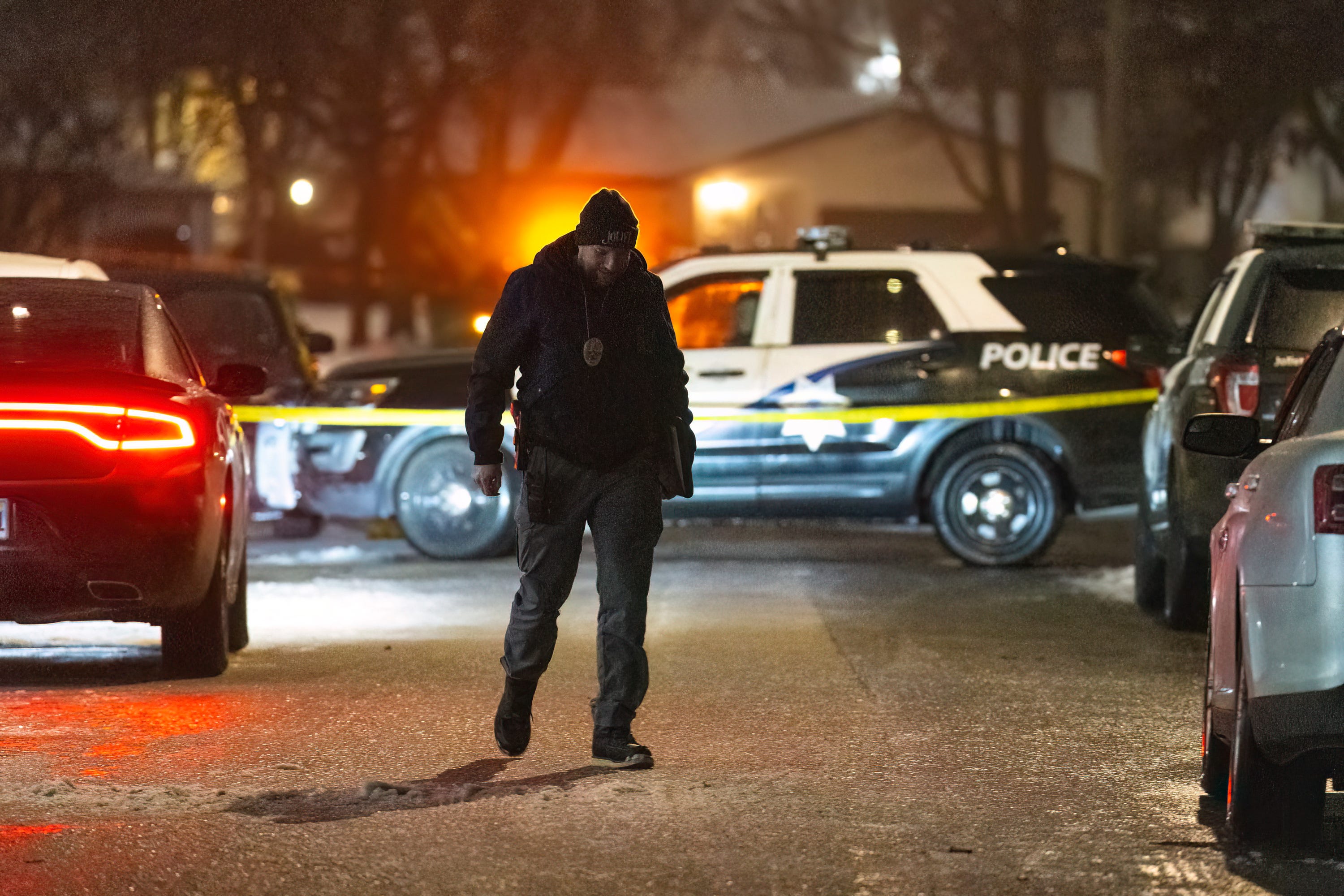 Police work a scene, Monday, Jan. 22, 2024, in Joliet, Ill., after multiple people were shot and killed over two days at three locations in the Chicago suburbs. (Tyler Pasciak LaRiviere/Chicago Sun-Times via AP) ORG XMIT: ILCHS171