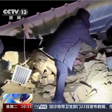 In this image taken from video footage run by China's CCTV, rescuers work near the rubble from an earthquake in Kizilsu Kirghiz Autonomous Prefecture, China's western Xinjiang region Tuesday, Jan. 23, 2024. A strong earthquake struck China's far western Xinjiang region early Tuesday, knocking out power and destroying homes, local authorities and state media reported. (CCTV via AP) ORG XMIT: TKMY801