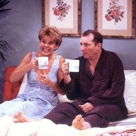 MARRIED ...WITH CHILDREN: Fill it to the rim with... Al? Arch-nemesis Al Bundy (Ed O'Neill, R) and Marcy (Amanda Bearse, L) come to a special understanding in the episode "Kiss of the Coffee Woman" Sunday, May 5 (9:00-9:30 PM ET/PT) on FOX. FOX BROADCASTING COMPANY CR: DOUG HYUN ORG XMIT: FOX5