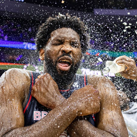 Philadelphia 76ers center Joel Embiid is doused with water by teammates after scoring 70 points in a victory against the San Antonio Spurs at Wells Fargo Center.