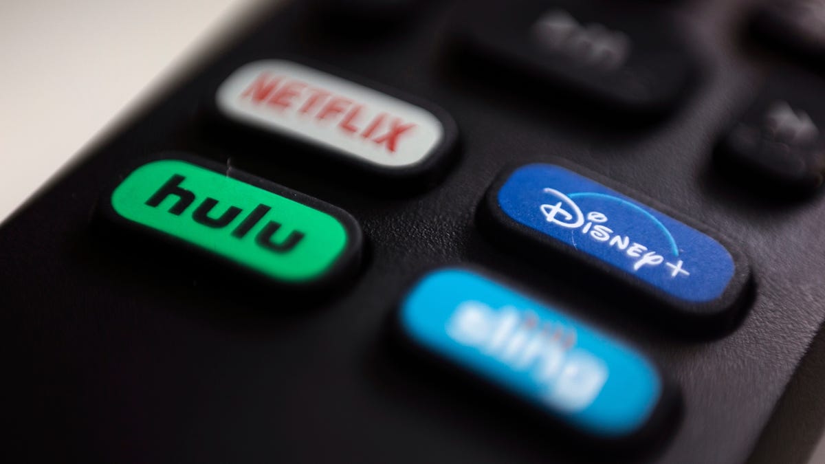 Logos for Netflix, Hulu, Disney Plus and Sling TV are pictured on a remote control.