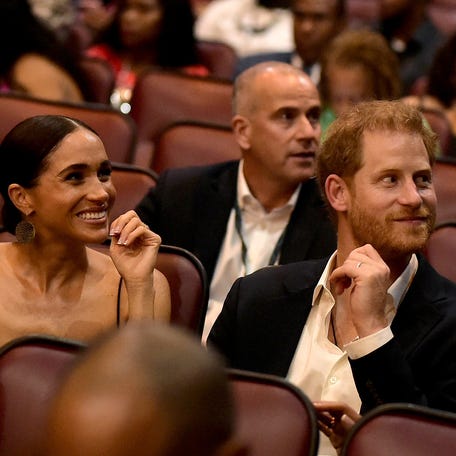 KINGSTON, JAMAICA - JANUARY 23: (L-R) Meghan, Duchess of Sussex and Prince Harry, Duke of Sussex attends the Premiere of 