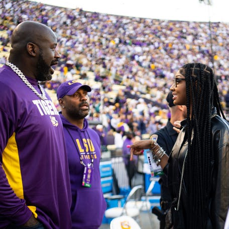 Angel Reese (right) first met LSU legend Shaquille O'Neal when they were both on the sideline of a Tigers football game.