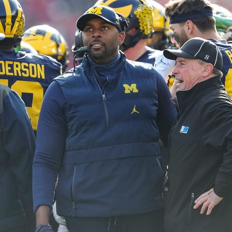 Michigan acting head coach Sherrone Moore watches a replay during the first half against Ohio State at Michigan Stadium in Ann Arbor on Saturday, Nov. 25, 2023.