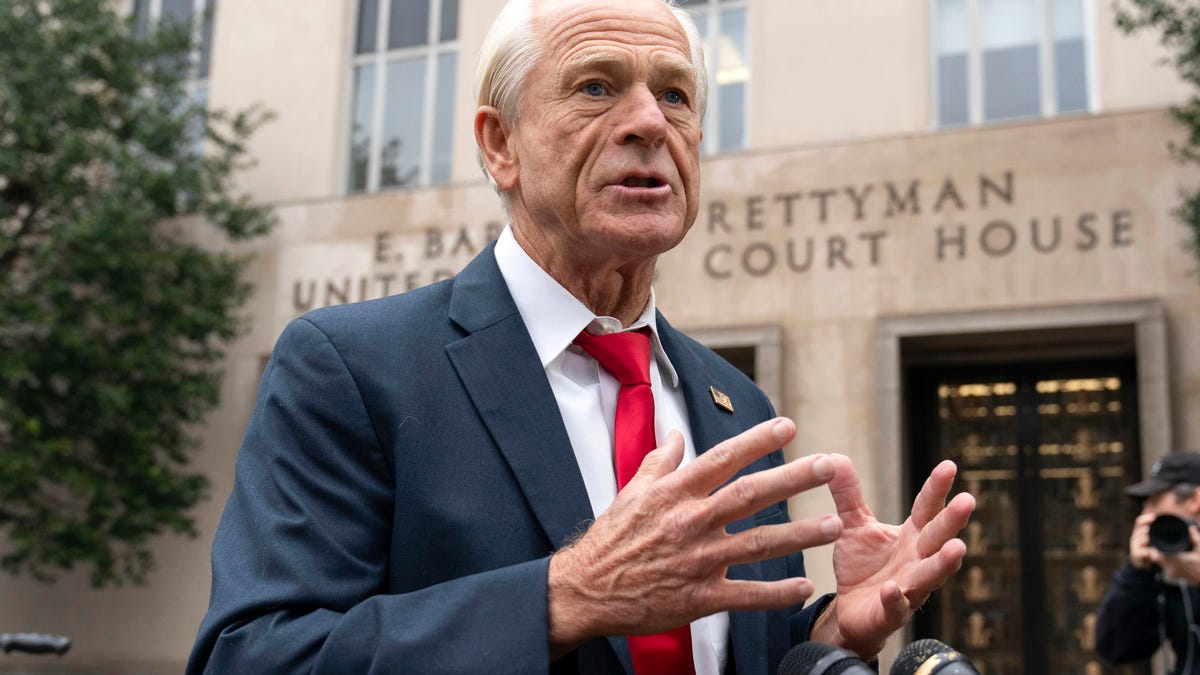 Former Trump White House official Peter Navarro talks to the media as he arrives at U.S. Federal Courthouse in Washington on Jan. 25, 2024.