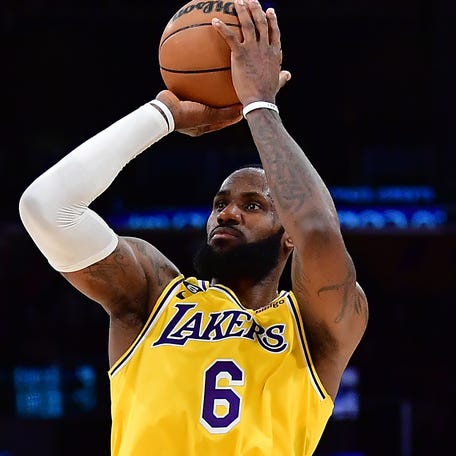 Los Angeles Lakers forward LeBron James, right, was named an NBA All-Star for the 20th consecutive time, while Dallas Mavericks guard Luka Doncic, left, earned his fifth All-Star nod.