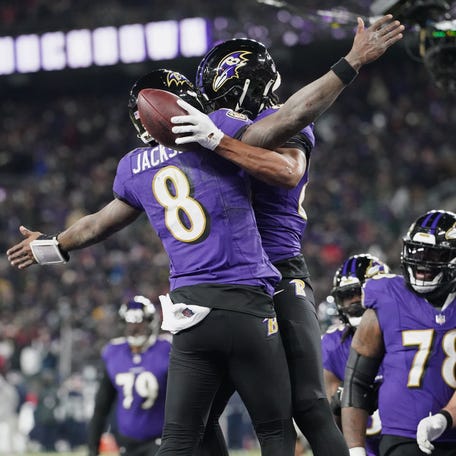 Ravens tight end Isaiah Likely (80) celebrates with quarterback Lamar Jackson (8) after a touchdown against the Texans during the fourth quarter of their AFC divisional round game at M&T Bank Stadium in Baltimore on Jan. 20, 2024.