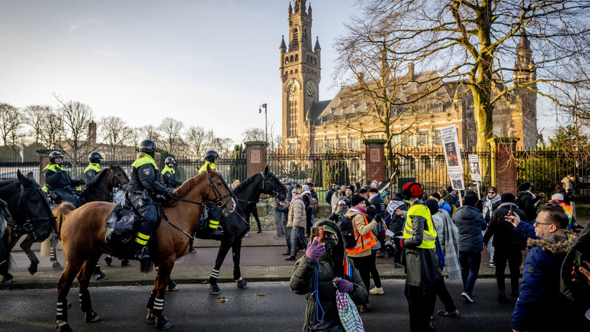 Police officers disperse protestors during a demonstration in support of Palestinians during a hearing at the International Court of Justice (ICJ) on a genocide complaint by South Africa against Israel, in The Hague, on Jan. 11, 2024.