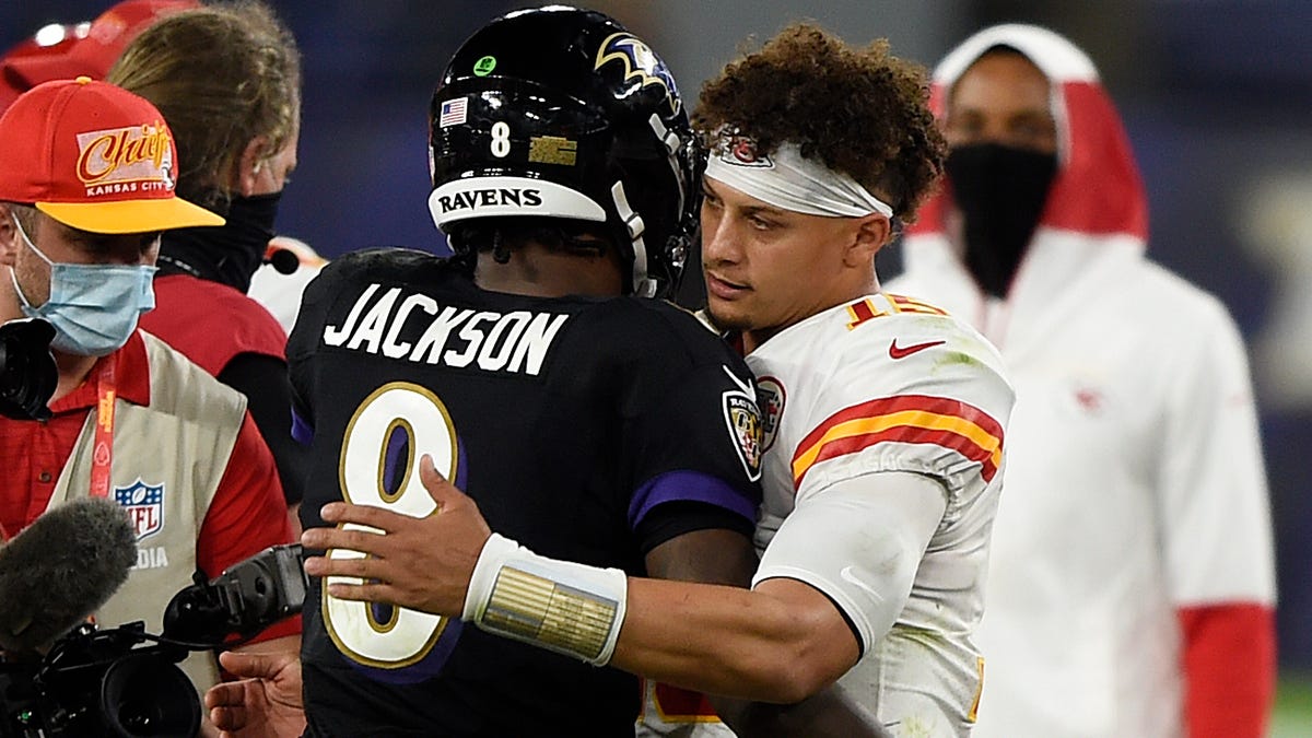 Lamar Jcakson and Patrick Mahomes embrace after a 2020 game in Baltimore.