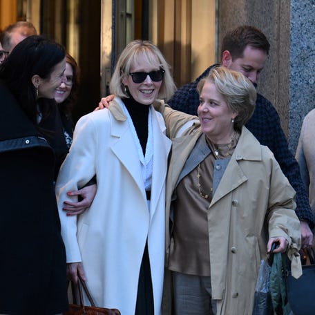 Writer E. Jean Carroll (C) leaves federal court after the verdict in her defamation case against former US president Donald Trump in New York on January 26, 2024. Trump was ordered Friday by a New York jury to pay $83 million in damages to Carroll, whom he publicly insulted and called a liar for alleging that he sexually assaulted her. The jury reached its decision after slightly less than three hours of deliberations. Trump made multiple comments about Carroll   while he was president, demeaning her in the wake of her allegation of a 1990s assault.