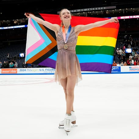 Jan 26, 2024 : Amber Glenn takes a victory lap around the rink following the championship women medal ceremony during the 2024 US Figure Skating Championships at Nationwide Arena.