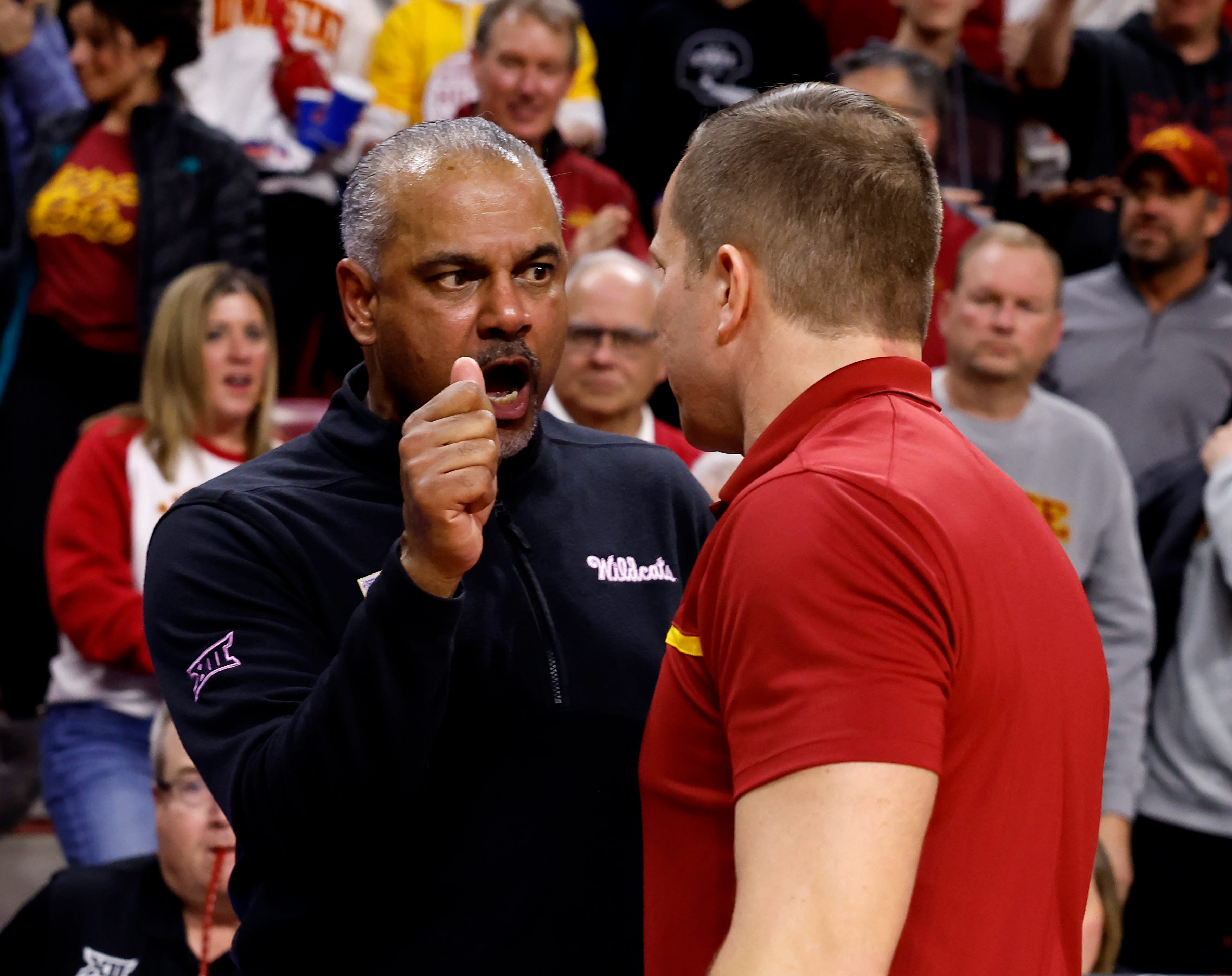 Kansas State coach Jerome Tang, left, and Iowa State coach T. J. Otzelberger had an intense exchange in the handshake line after Iowa State beat the Wildcats 78-67 on Jan. 24, 2024, in Ames.