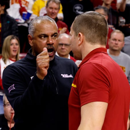 Kansas State coach Jerome Tang, left, and Iowa State coach T. J. Otzelberger had an intense exchange in the handshake line after Iowa State beat the Wildcats 78-67 on Jan. 24, 2024, in Ames.