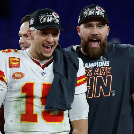 Kansas City Chiefs quarterback Patrick Mahomes (15) and tight end Travis Kelce (R) celebrate after their 17-10 win against the Baltimore Ravens in the AFC Championship.