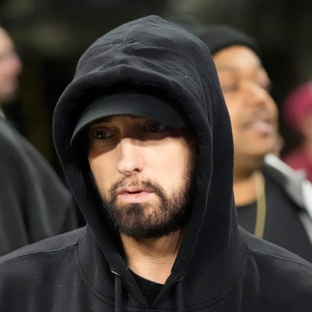 Eminem is seen during pregame of the NFL wild-card playoff game between the Detroit Lions and Los Angeles Rams on Jan. 14, 2024.