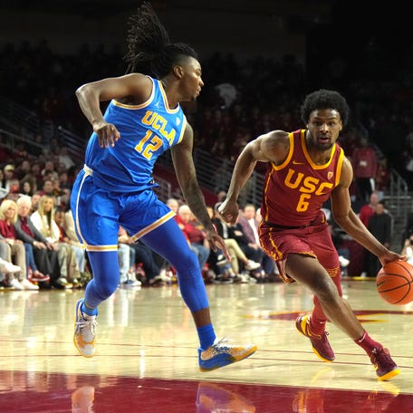 Southern California Trojans guard Bronny James (6) dribbles the ball against UCLA Bruins guard Sebastian Mack (12) in the second half at Galen Center. The Trojans and Bruins have been two of the most underwhelming teams in the 2023-24 season.