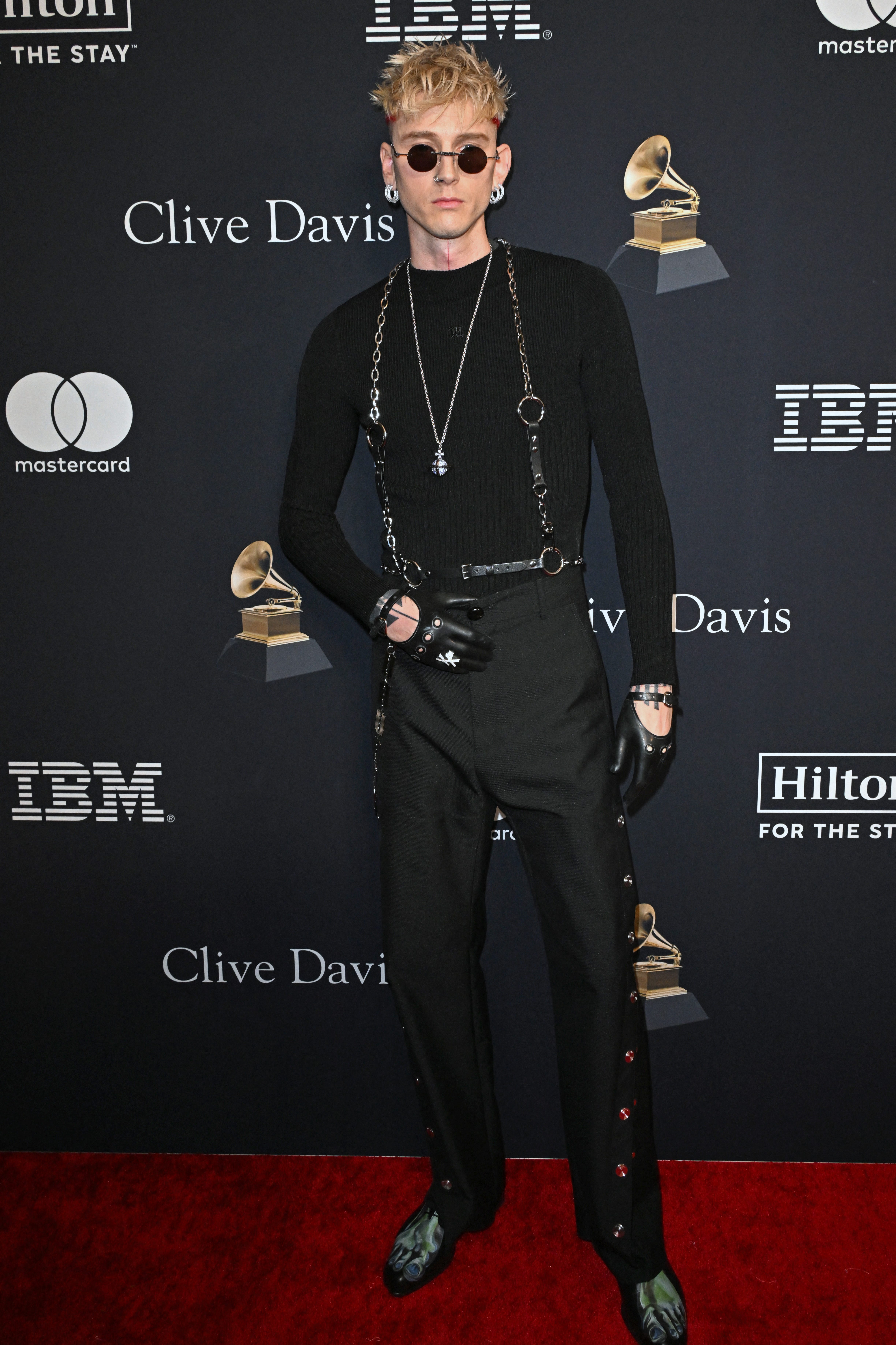 US rapper Machine Gun Kelly arrives for the Recording Academy and Clive Davis' Salute To Industry Icons pre-Grammy gala at the Beverly Hilton hotel in Beverly Hills, California on February 3, 2024. (Photo by Robyn BECK / AFP) (Photo by ROBYN BECK/AFP via Getty Images) ORG XMIT: 776093805 ORIG FILE ID: 1976114565