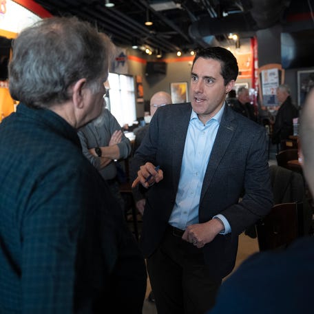 Feb 2, 2024; Marysville, Ohio, US; U.S. Senator Candidate and current Ohio Secretary of State Frank LaRose speaks to Randy Poland (left) during a campaign event at Boston's Restaurant and Sports Bar in Marysville, Ohio.
