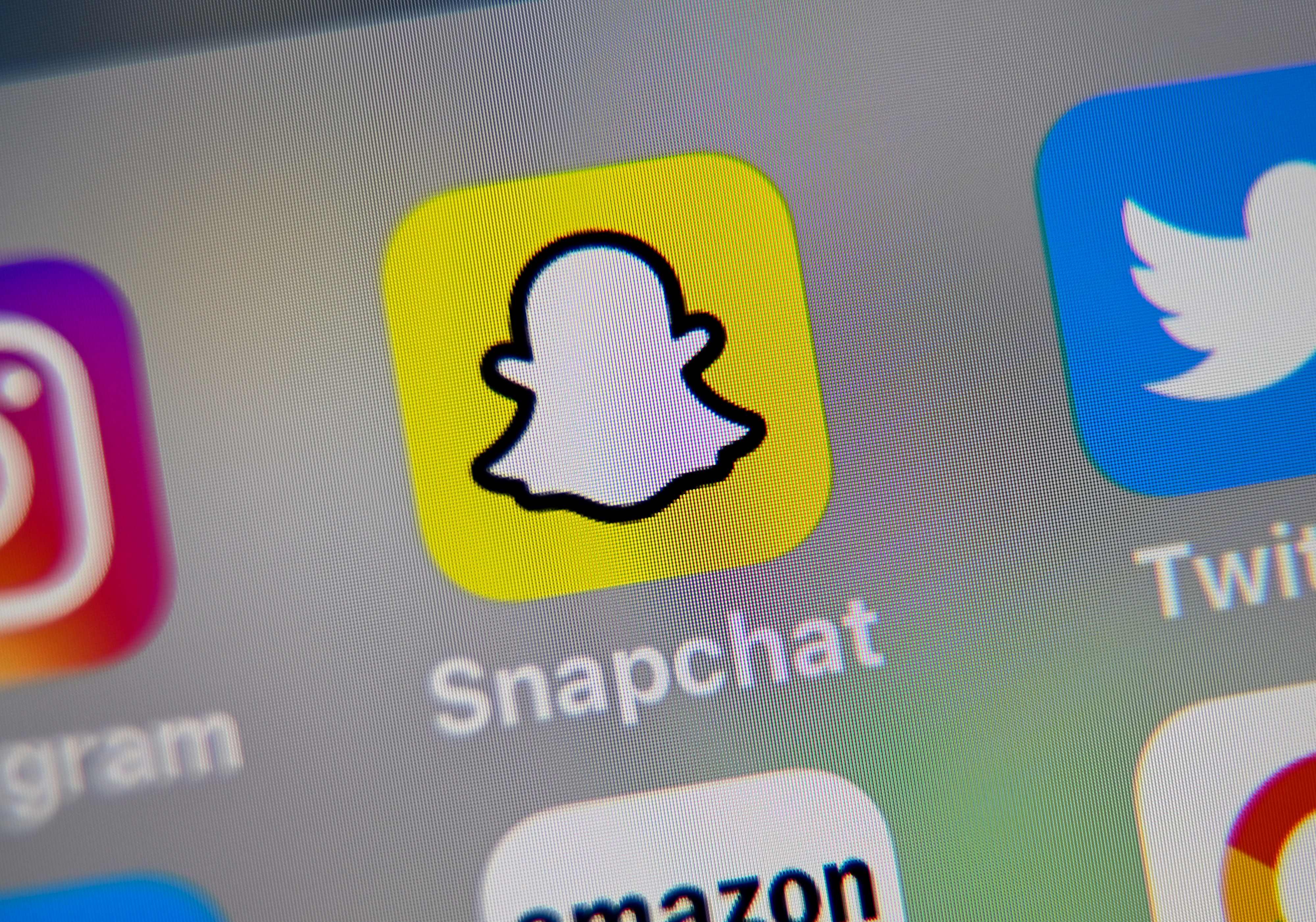 This file photo taken on October 1, 2019 shows the logo of mobile app Snapchat displayed on a tablet.
