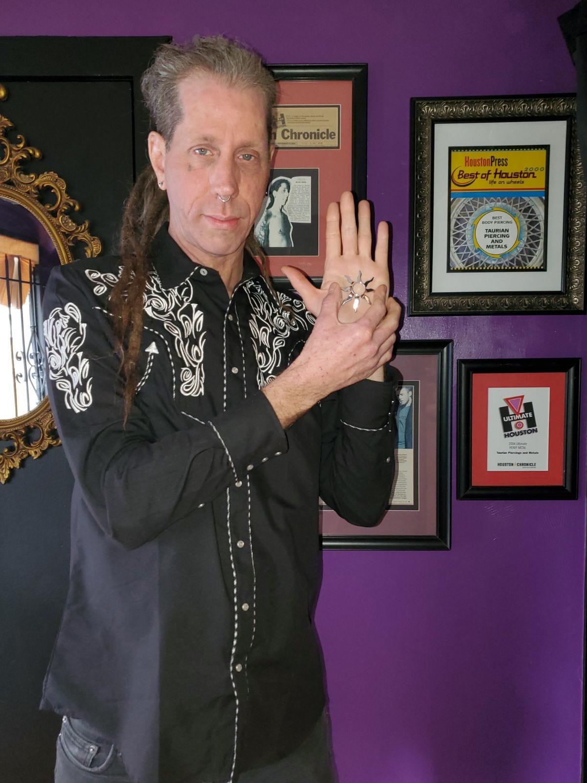 Byriah Dailey, the body piercer who says he sold Janet Jackson's stylist a nipple shield the week of Super Bowl 38, shows off the second shield of the pair. Dailey recently discovered the second shield in his garage.