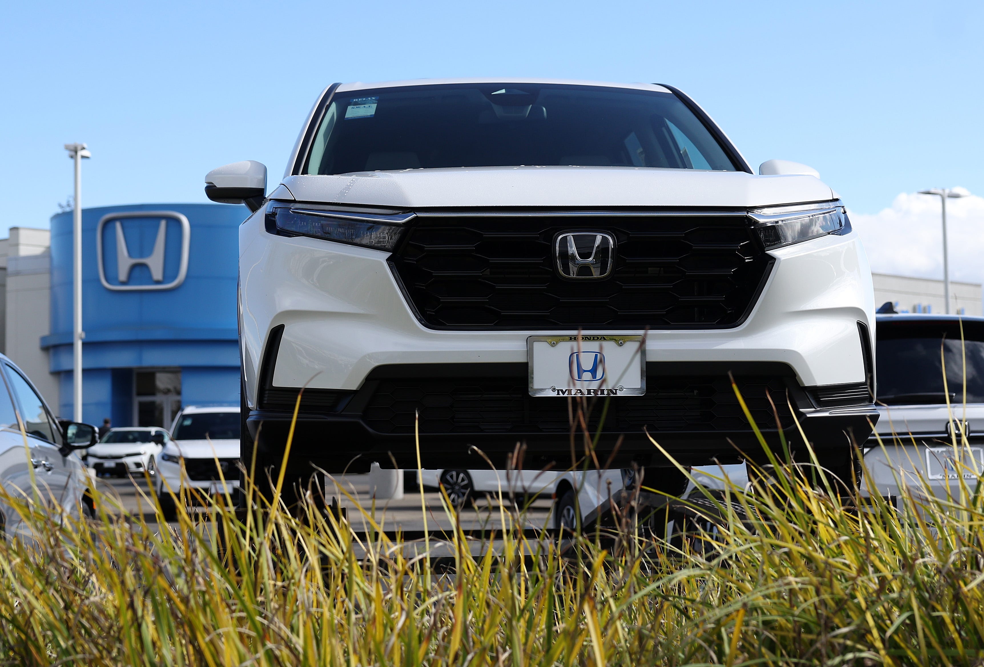 SAN RAFAEL, CALIFORNIA - FEBRUARY 06: A Brand new Honda Pilot is displayed on the sales lot at Honda Marin on February 06, 2024 in San Rafael, California. Honda announced the recall of 750,000 vehicles in the U.S. for an air bag defect that could unintentionally deploy the air bags in a collision. The recall includes certain 2020 to 2022 Honda Pilot, Accord and Civic vehicles as well as 2020 and 2021 model years of Honda CR-V and Passport vehicles. (Photo by Justin   Sullivan/Getty Images)