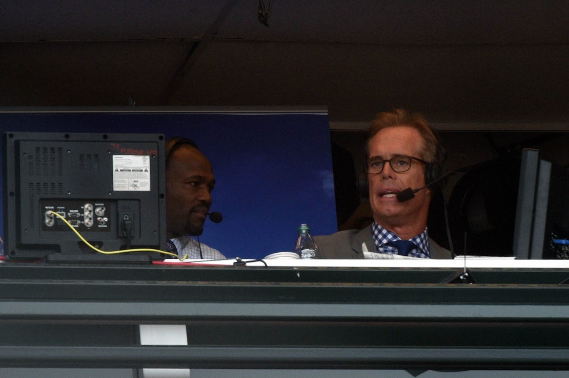 Fox Sports broadcasters Joe Buck, right, and Harold Reynolds call a game between the San Francisco Giants and the St. Louis Cardinals in the 2014 National League championship series.