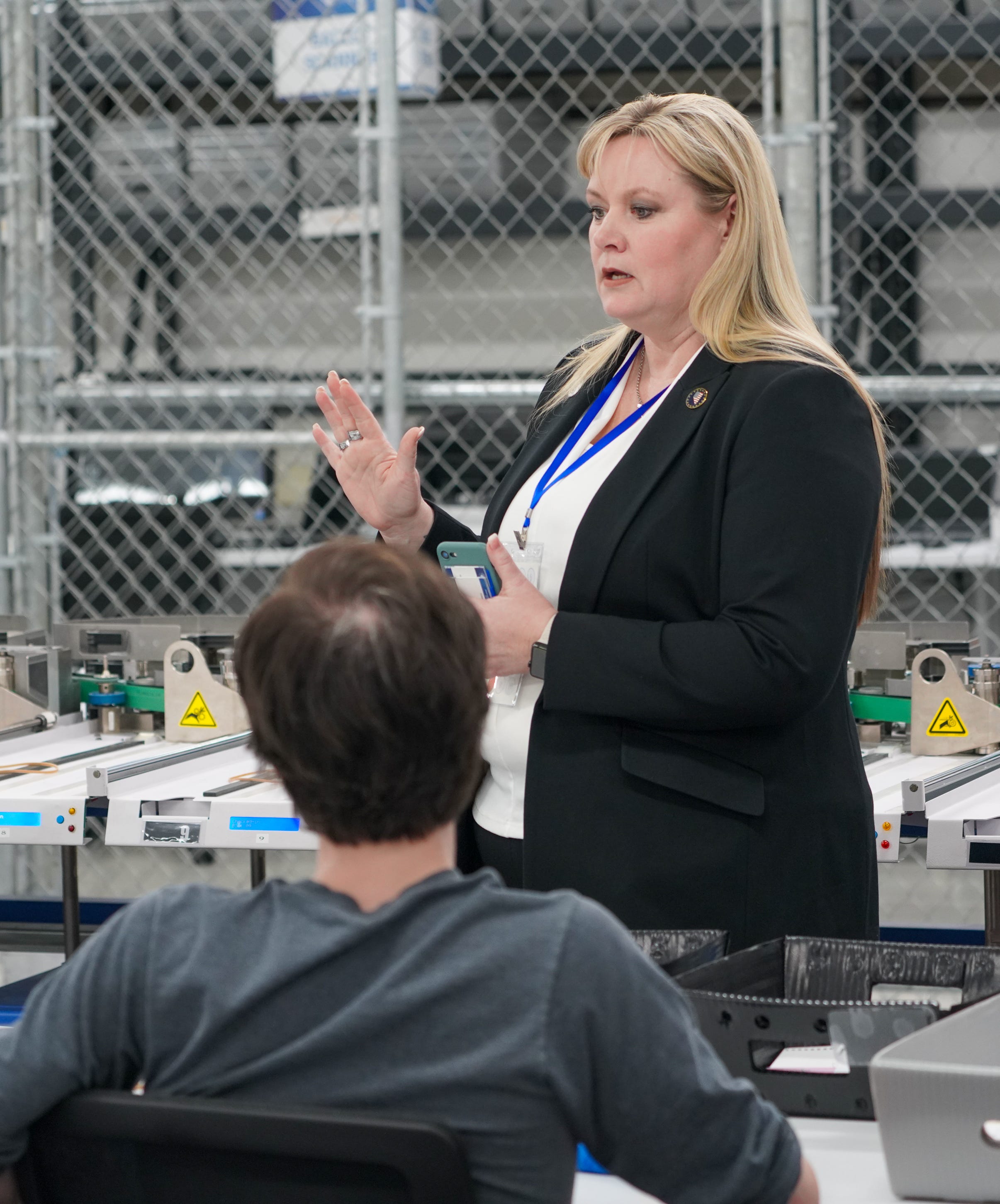 Election workers at the Washoe County (Nevada) Registrar of Voters office speak with interim Registrar Cari-Ann Burgess during the Feb. Presidential Primary Election. All 18 of the office's workers quit and had to be replaced between the 2020 election and the 2024 primary.
