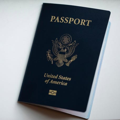 The cover of a U.S. passport is displayed in Tigard, Ore., Saturday, Dec. 11, 2021.