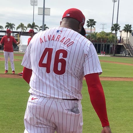Phillies relief pitcher Jose Alvarado, wearing the new Nike-designed MLB jersey, exits a practice field following a spring-training bullpen session in Clearwater, Florida.