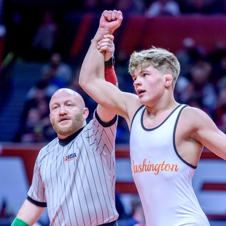 Washington's Wyatt Medlin takes the title in the 138-pound division of the Class 2A state wrestling championships Saturday, Feb. 17, 2024 at the State Farm Center in Champaign. Medline took a 10-3 decision over Mt. Vernon's Dillon White.