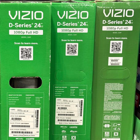 Vizio televisions are displayed at a store.