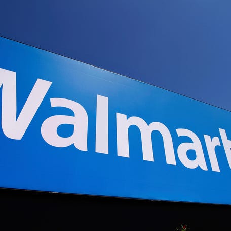 The Walmart logo is displayed on a store in Springfield, Illinois.
