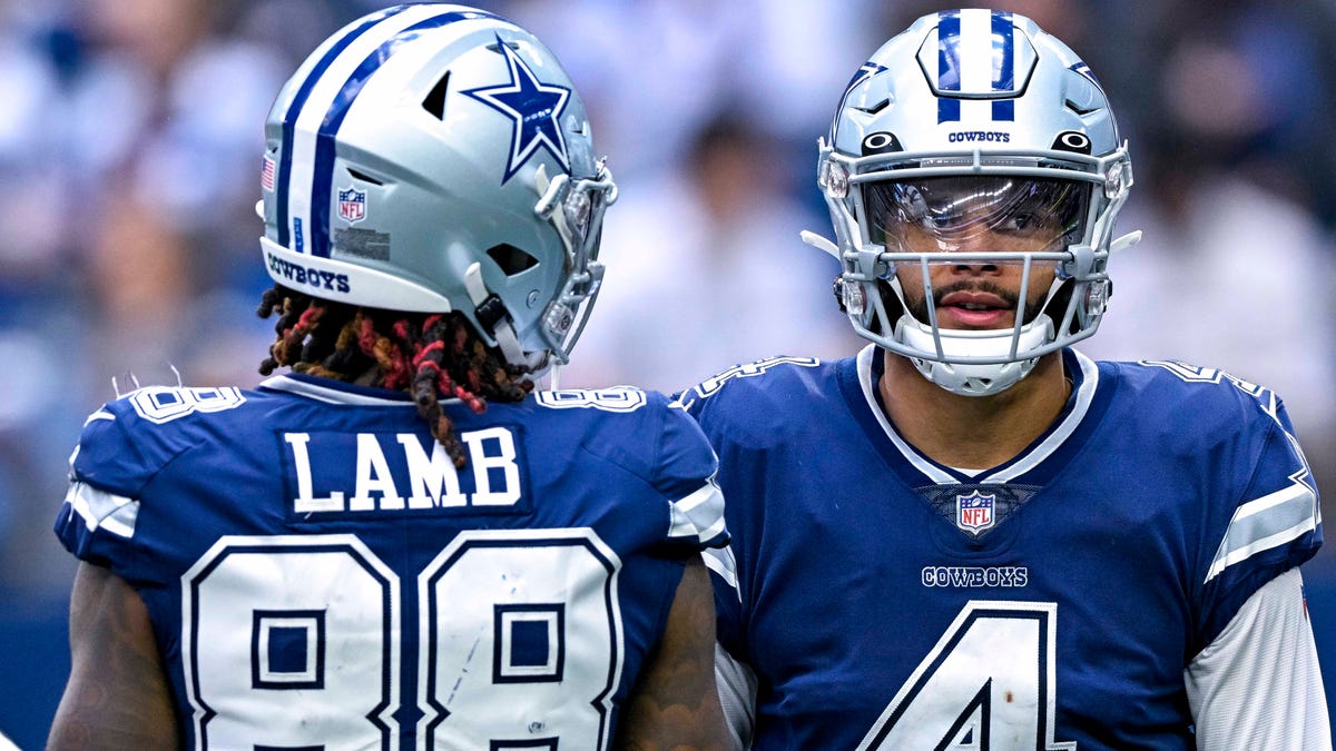 Oct 30, 2022; Arlington, Texas, USA; Dallas Cowboys wide receiver CeeDee Lamb (88) and quarterback Dak Prescott (4) wait for play to resume against the Chicago Bears during the second half at AT&T Stadium. Mandatory Credit: Jerome Miron-USA TODAY Sports ORG XMIT: IMAGN-489313 ORIG FILE ID: 20221030_jpm_an4_005543.JPG