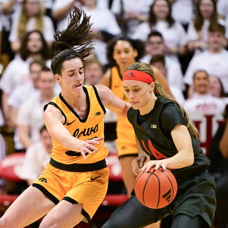 Caitlin Clark (left) defends against Indiana's Sara Scalia during the second quarter at Assembly Hall.