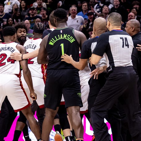 The Miami Heat and New Orleans Pelicans scuffle during their game Friday night.