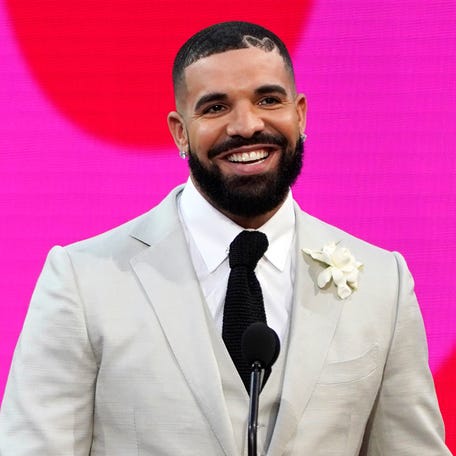 FILE - Drake appears at the Billboard Music Awards n Los Angeles on May 23, 2021. TikTok may look (or sound) a little different when you scroll through the app going forward. Earlier this week, Universal Music Group — which represents big-name artists like Taylor Swift, Bad Bunny and Drake — said that it would no longer allow its music on TikTok following the expiration of a licensing deal between the two companies, Wednesday, Jan. 31, 2024. Now, the   takedown of UMG-related music has begun, ByteDance-owned TikTok confirmed to The Associated Press. As of early Thursday, a vast roster of popular songs were disappearing from the social media platform's library. (AP Photo/Chris Pizzello, File) ORG XMIT: NYPS213