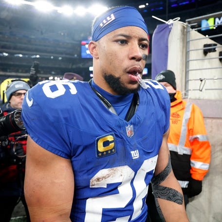 Saquon Barkley of the New York Giants walks off the field after a win over the Philadelphia Eagles at MetLife Stadium on January 07, 2024 in East Rutherford, New Jersey.