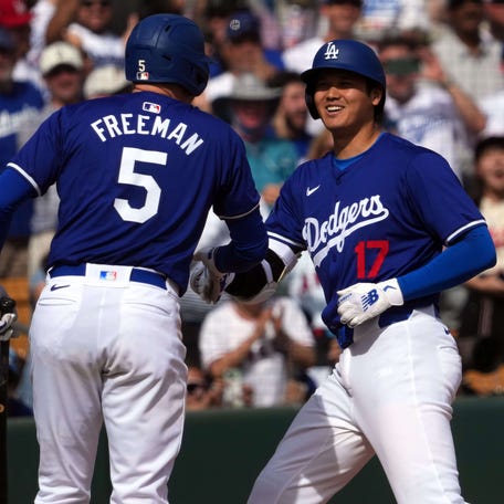 Los Angeles Dodgers DH Shohei Ohtani celebrates with first baseman Freddie Freeman after hitting a two-run home run in the fifth inning against the Chicago White Sox.