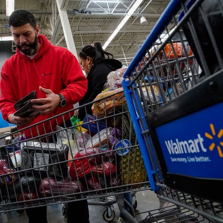 Francisco Santana shops at the Walmart Supercenter in North Bergen, N.J., on Thursday, Feb. 9, 2023. The inflation surge led Santana, a New York City resident, to shift his grocery shopping from local chains to Walmart. (AP Photo/Eduardo Munoz Alvarez) ORG XMIT: NYPM410
