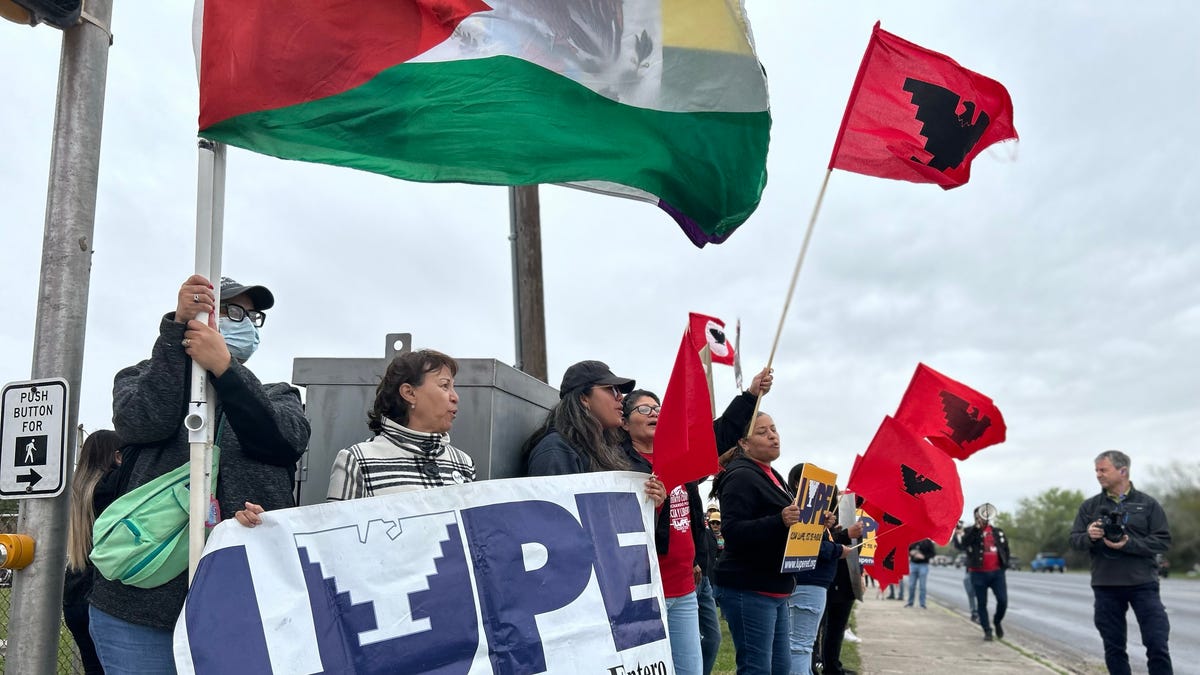 Several hundred mostly Biden supporters lined up on Boca Chica Boulevard outside Brownsville's airport prior to Biden's arrival Thursday, waving blue Biden flags and chanting 