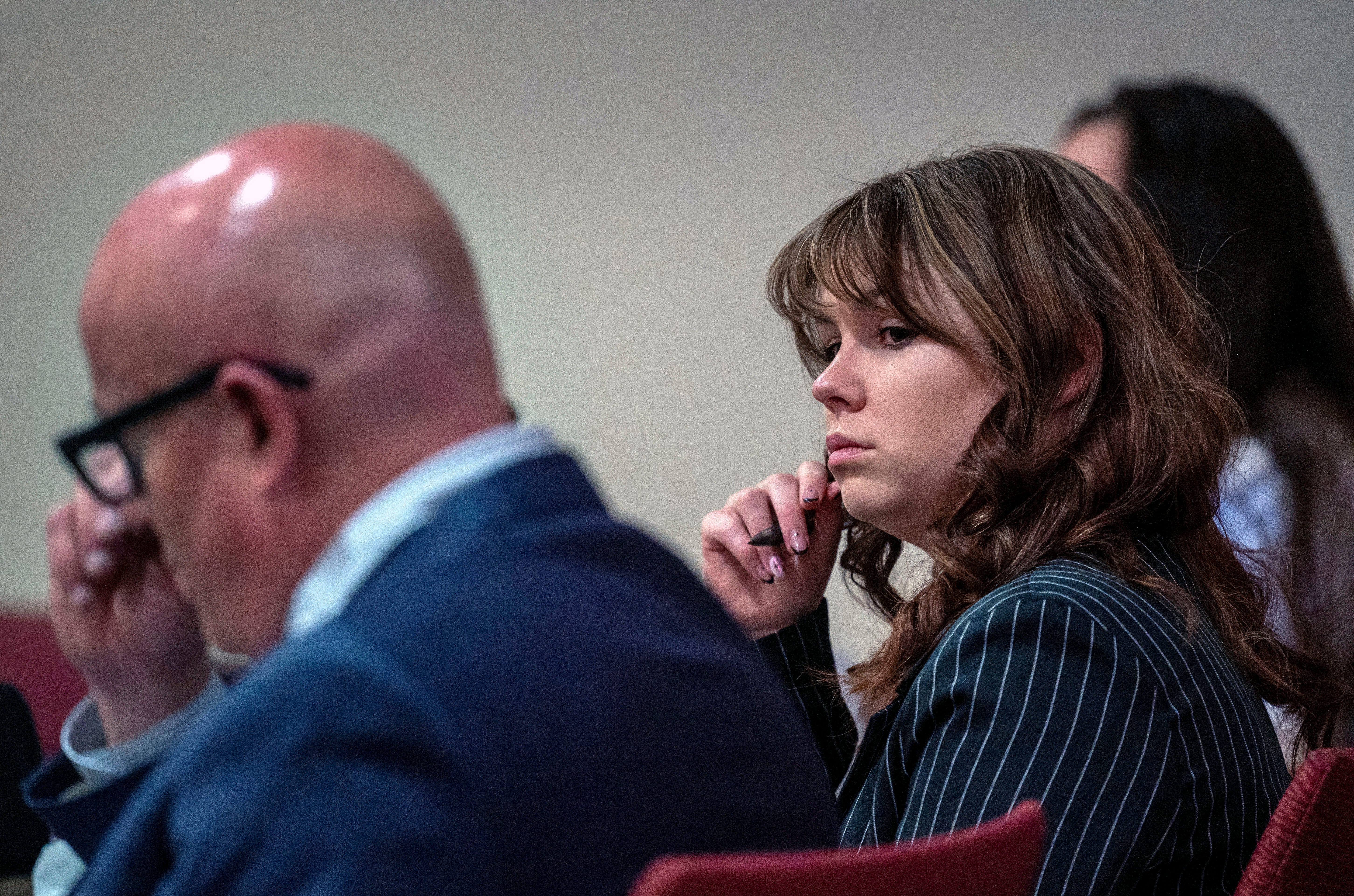 Hannah Gutierrez-Reed, center, sits with her attorney Jason Bowles, left, during testimony in her trial in Santa Fe, New Mexico, on March, 1, 2024. Gutierrez-Reed was working as the armorer on the movie "Rust" when actor Alec Baldwin fatally shot cinematographer Halyna Hutchins and wounded the film's director, Joel Souza.