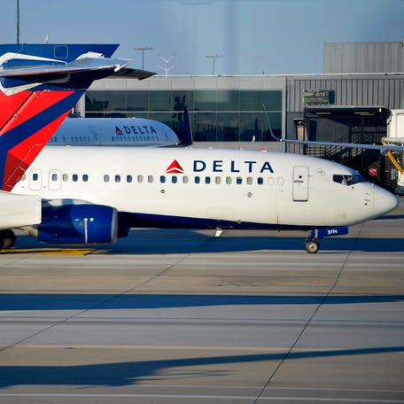A Delta Air Lines aircraft on Thursday, Dec. 2, 2021, at Hartsfield-Jackson Atlanta International Airport, in Atlanta.
