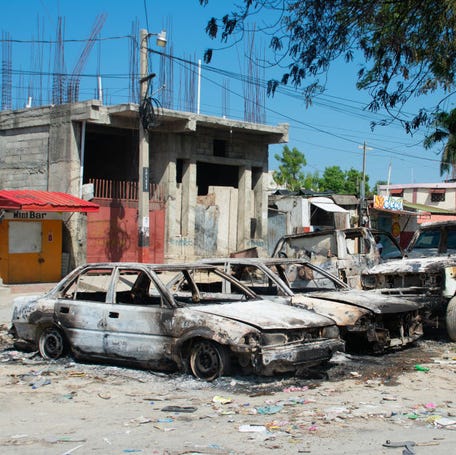 Charred vehicles remain parked as gang violence escalates in Port-au-Prince, Haiti, on March 9, 2024.