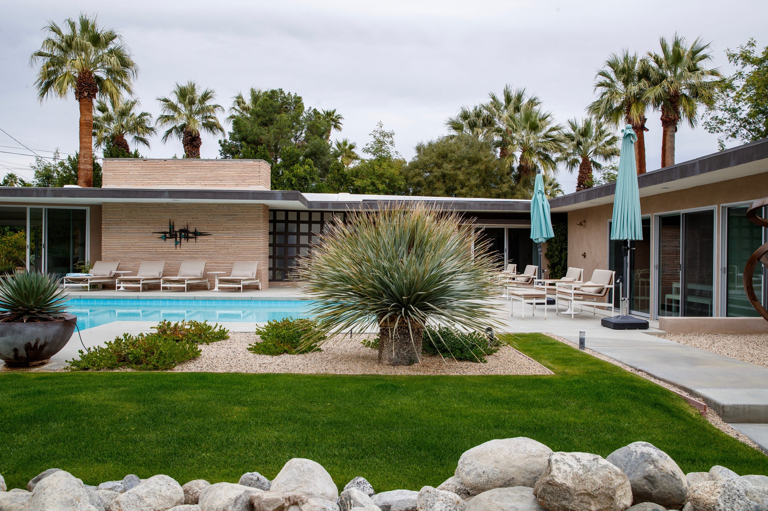 This restored 1949 home designed by architect Herbert Burns features horizontal-laid sandstone and terrazzo floors. The home received recognition on May 12, 2022, as a Designated Class 1 Historic Site in Palm Springs, California.