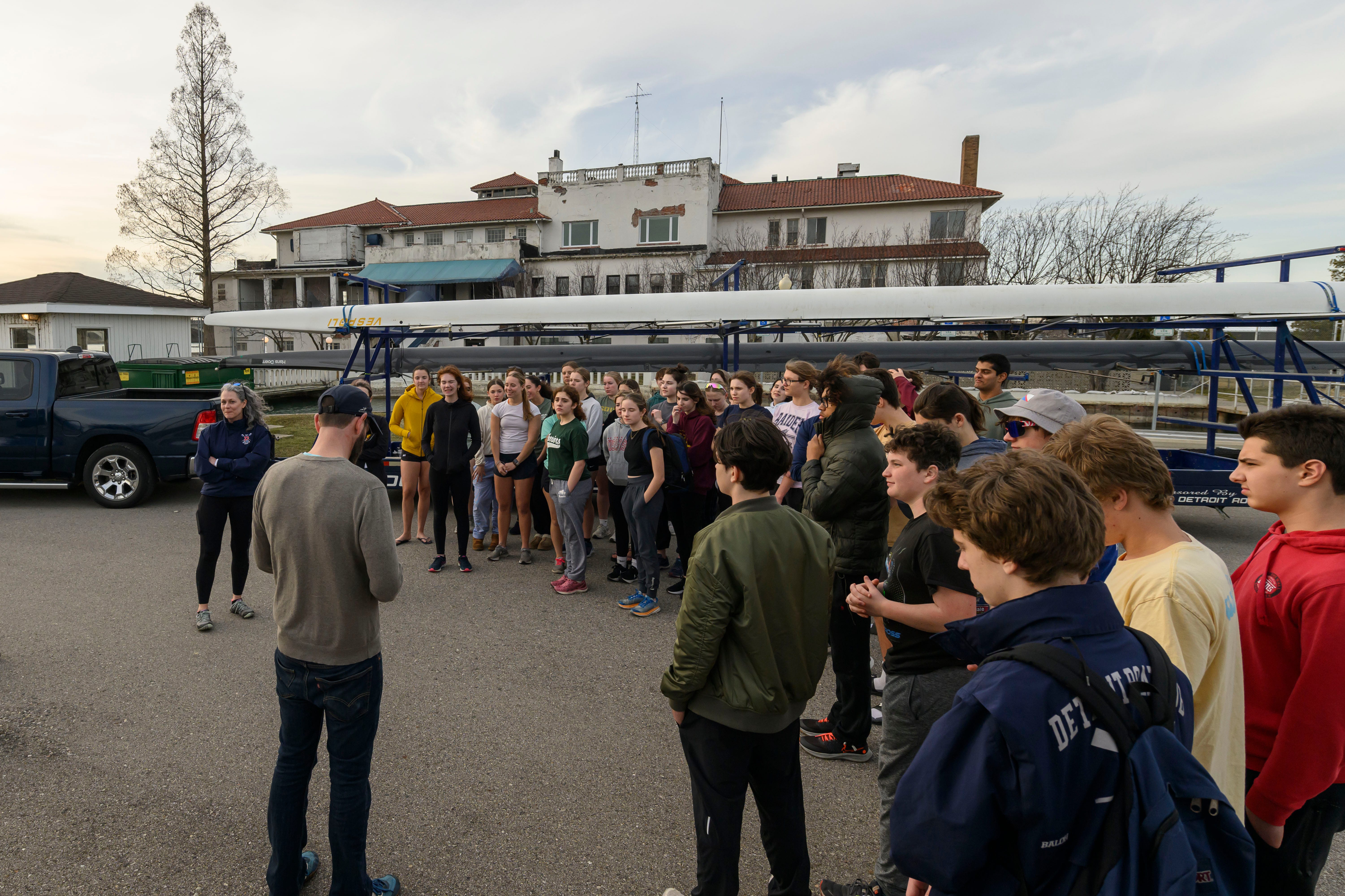 A meeting of the Detroit Boat Club Crew takes place outside the Detroit Boat House, on Belle Isle, March 12, 2024. The club is not allowed inside the boat house since structural damage made the building unsafe.